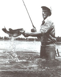
To get a good action shot of fishing, have the angler reenact landing a fish, splashing water to create the excitement of the moment.
